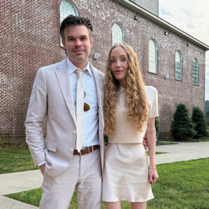 Ryan and Elizabeth Kaufmann standing outside