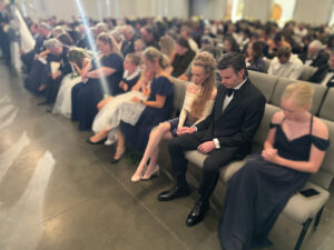 Ryan and Elizabeth Kaufmann praying at Remnant Fellowship Church