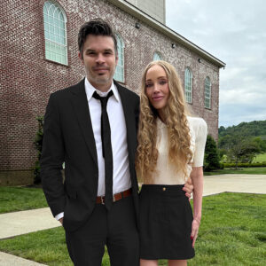 Ryan and Elizabeth Kaufmann standing outside
