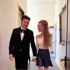 Ryan and Elizabeth Kaufmann walking down a hallway