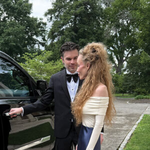 Ryan and Elizabeth Kaufmann by the car